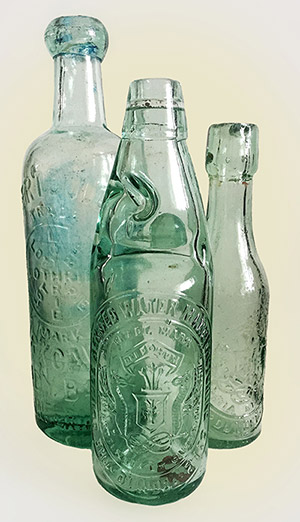 Aerated water bottles: front and right are Dundee Aerated Water Manufacturing Company bottles, on the left is Robert Douglas of Kirkcaldy, advertising his Lothrie waters.